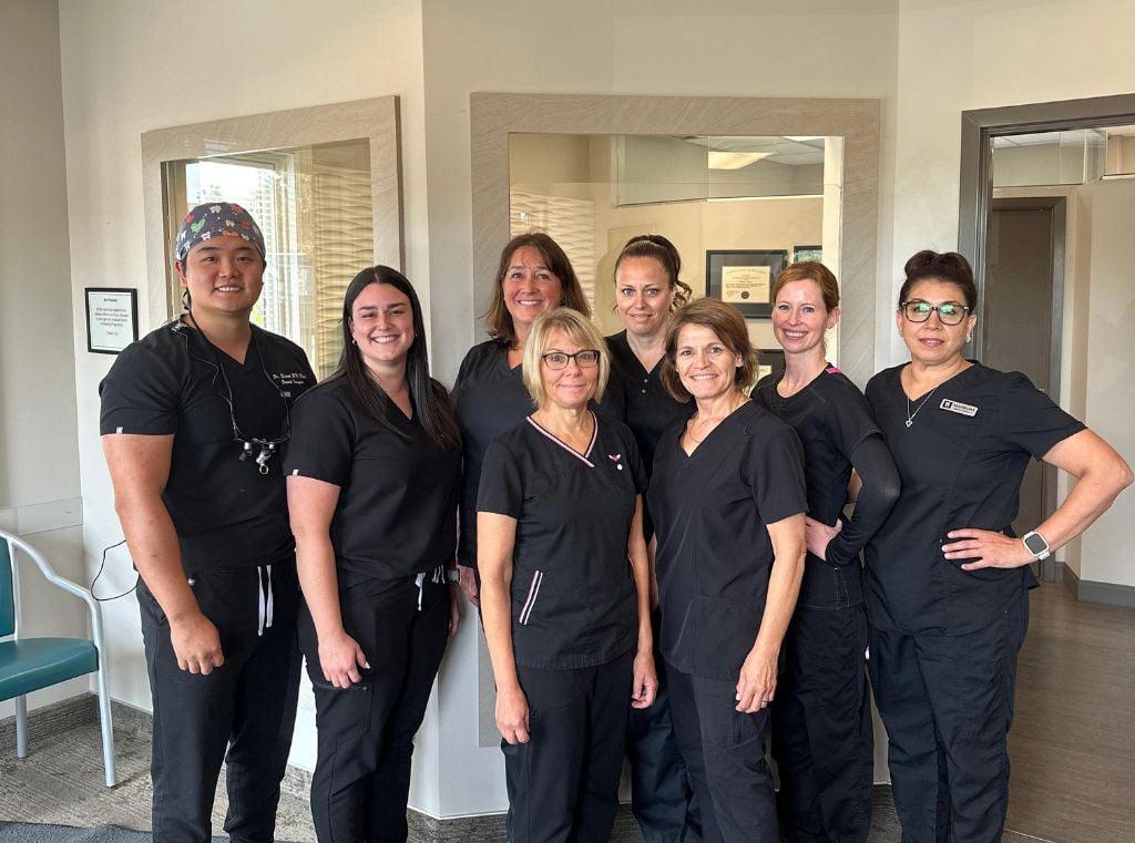 Dental team at Walk In The Park Family Dental in Kitchener posing together inside the clinic